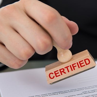 "Certified" being stamped on paper