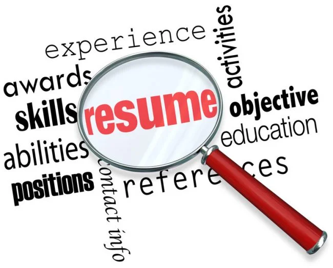 A magnifying glass focusing in on what it takes to craft the best Canadian résumé