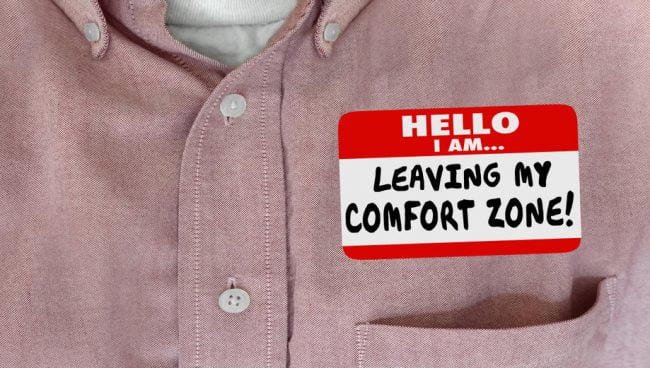 Man wearing name tag on his shirt which reads "Hello, I am leaving my comfort zone!"